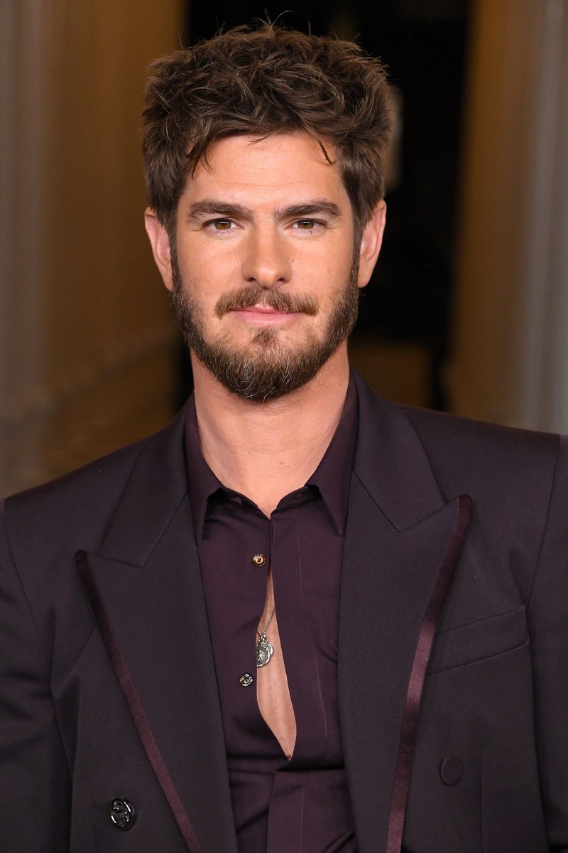 Man with short, textured hair and a low fade, styled neatly with a clean-cut appearance